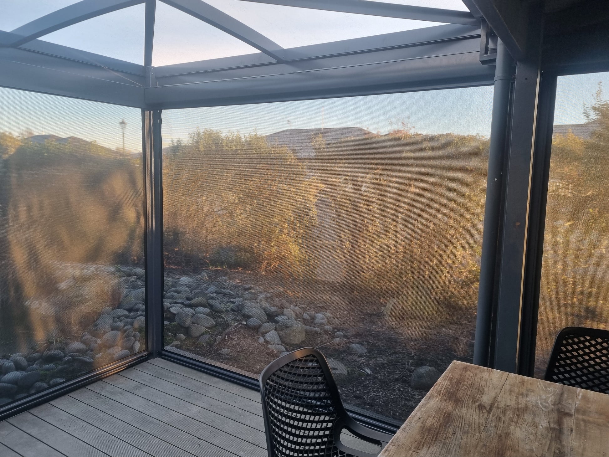 Enclosed outdoor area with a BowTec Roof and Ziptrak outdoor blinds